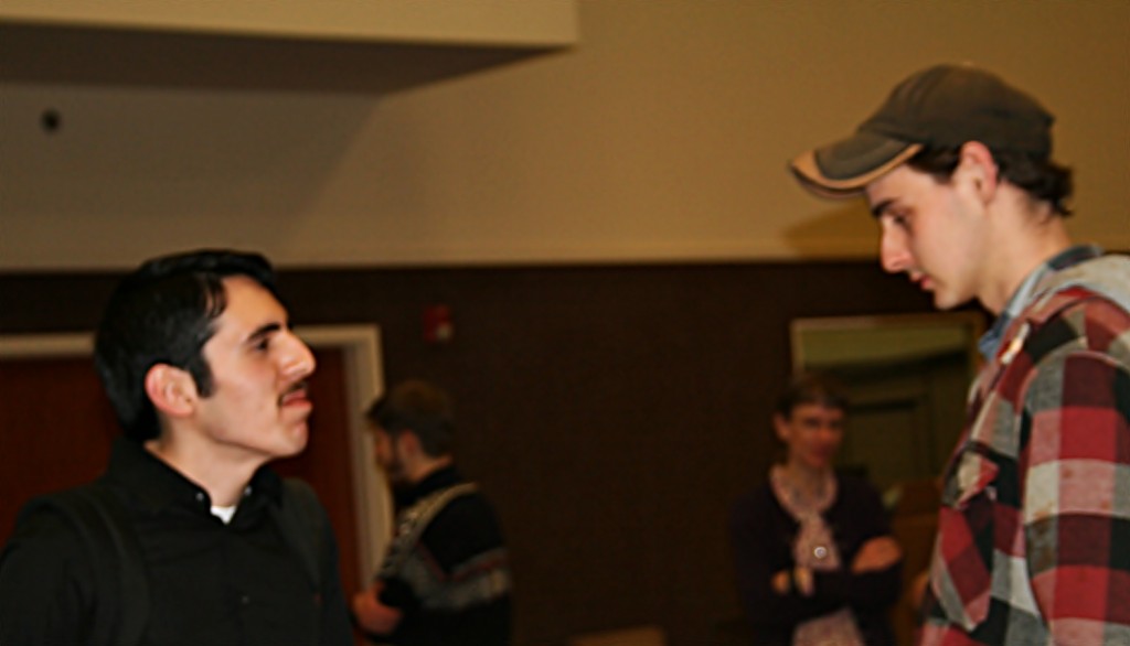 The young men converse about  the lectures from the day.