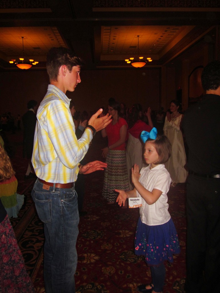 Brother and sister dancing. 