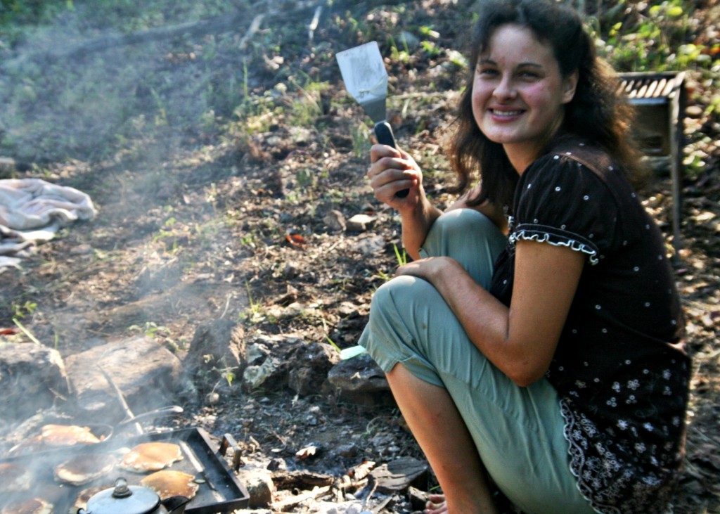 The happy camper prepares breakfast! 