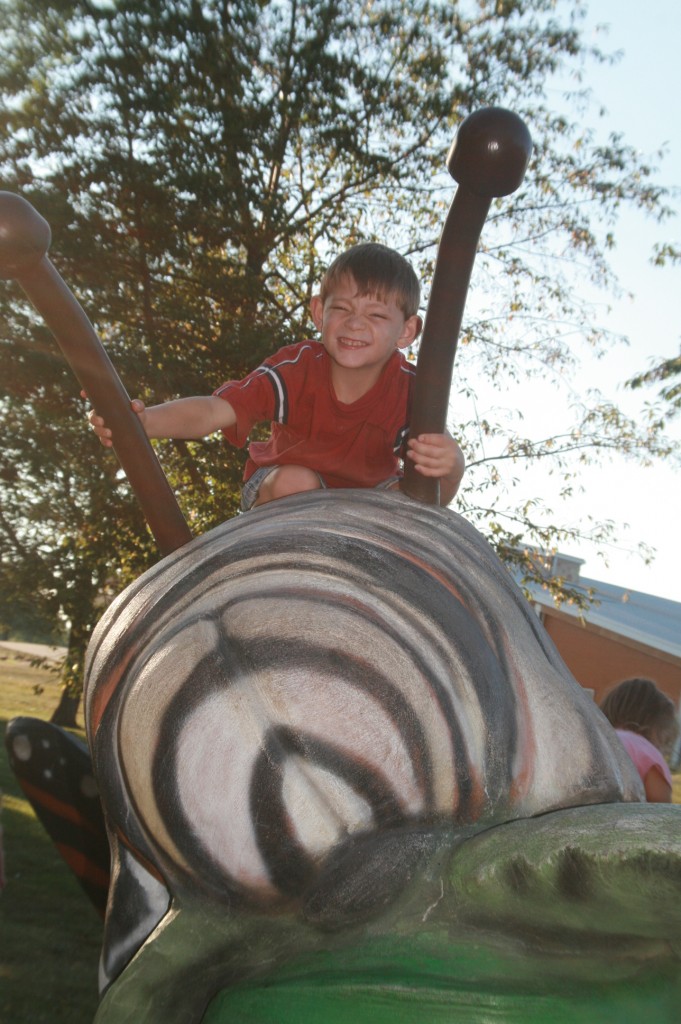 Paul mounts the giant caterpillar. 