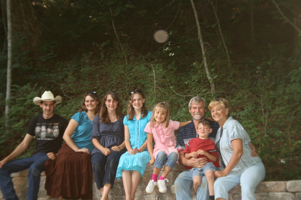 A family picture., courtesy of a neighboring sign post. 